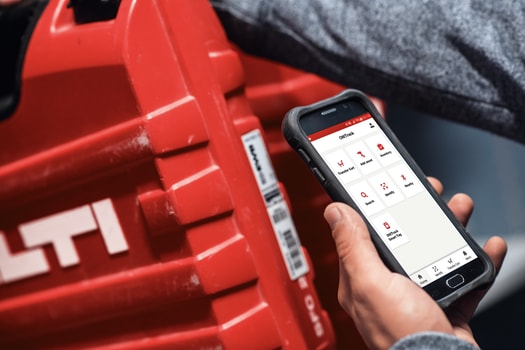 a man uses ON!Track on a mobile device to scan a hilti tool box