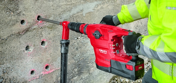 TE 60-A36 with dust removal system drilling holes in concrete wall