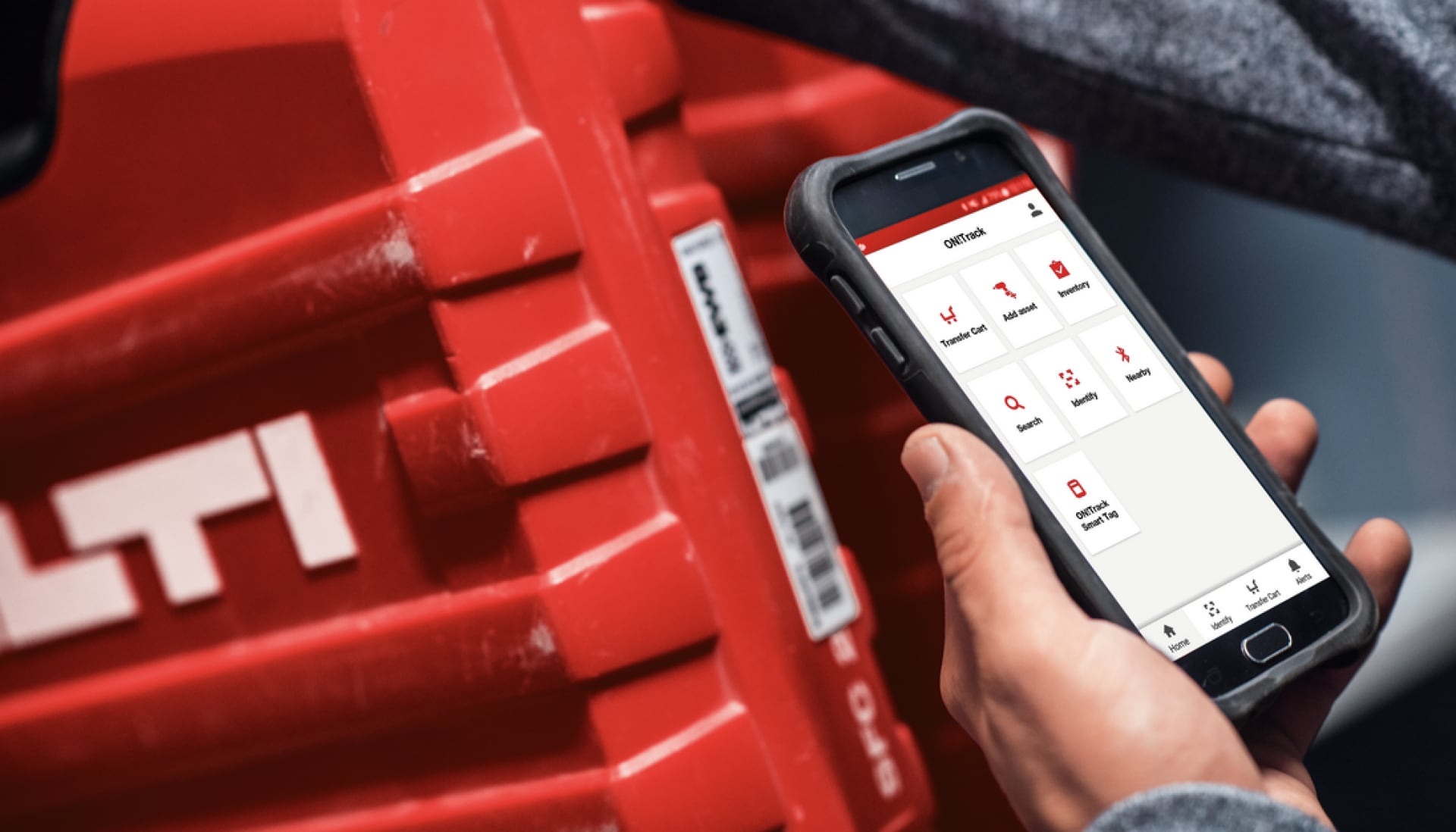 a man uses ON!Track on a mobile device to scan a hilti tool box