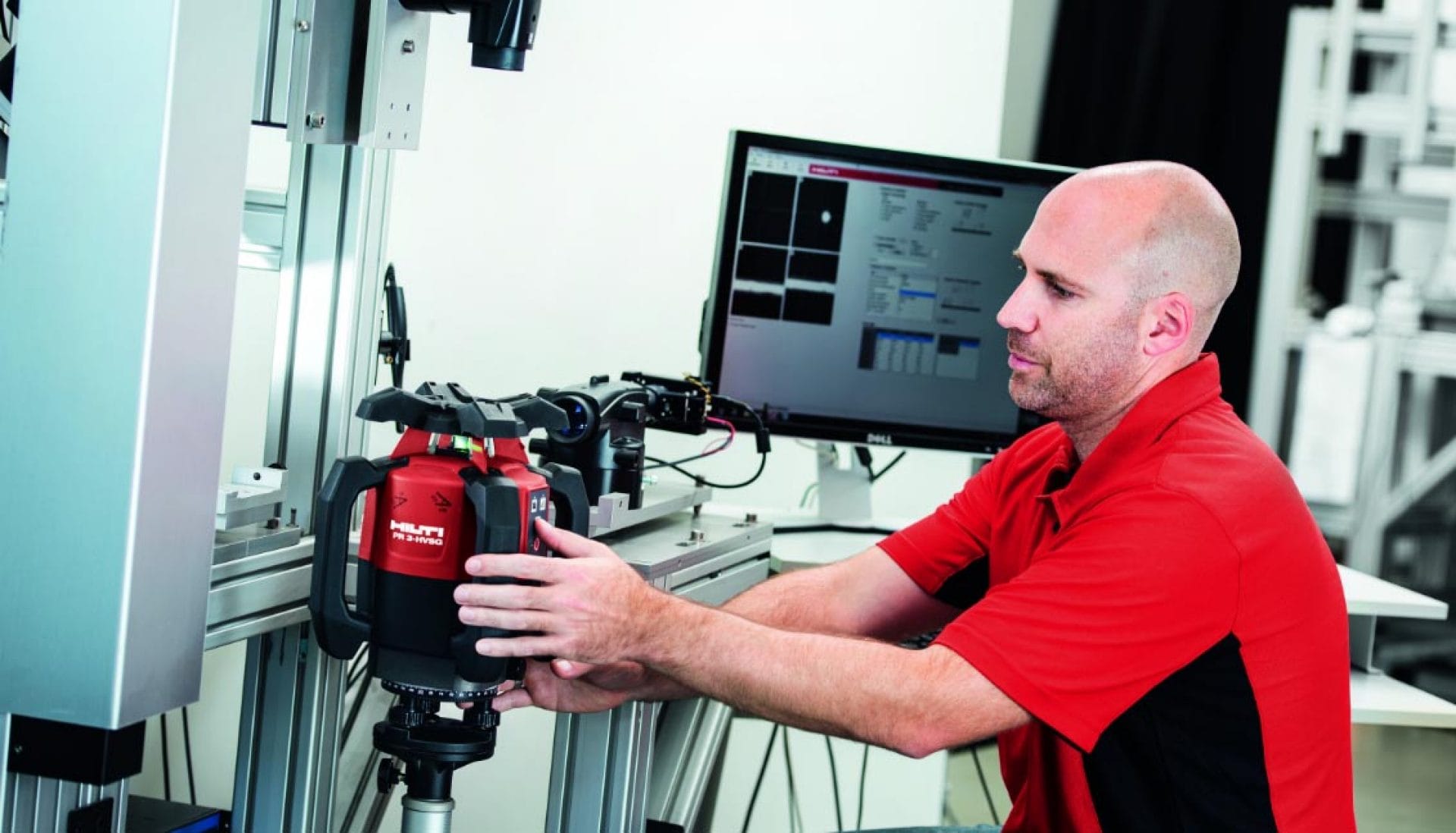 Hilti technician calibrating a rotating laser