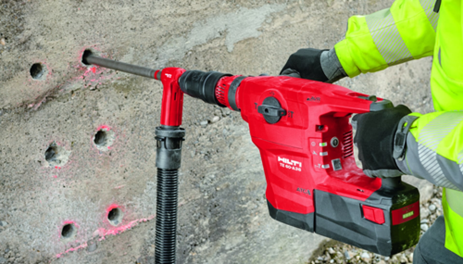 TE 60-A36 with dust removal system drilling holes in concrete wall