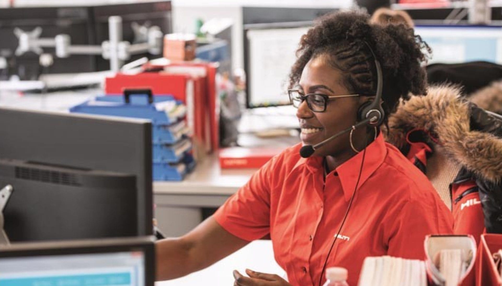 a Hilti customer service team member speaks to a customer over the phone