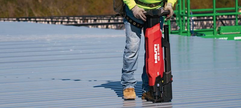 Nailing decking - Hand holding Paslode nail gun framing gun Stock Photo -  Alamy